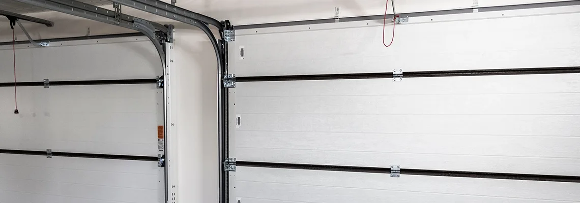 Fix Folding Garage Door Jerking in Nepean, Ontario
